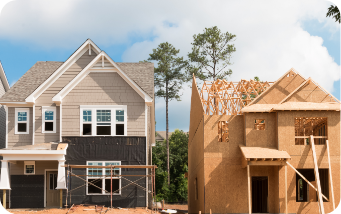 A new build under construction next to a completed home